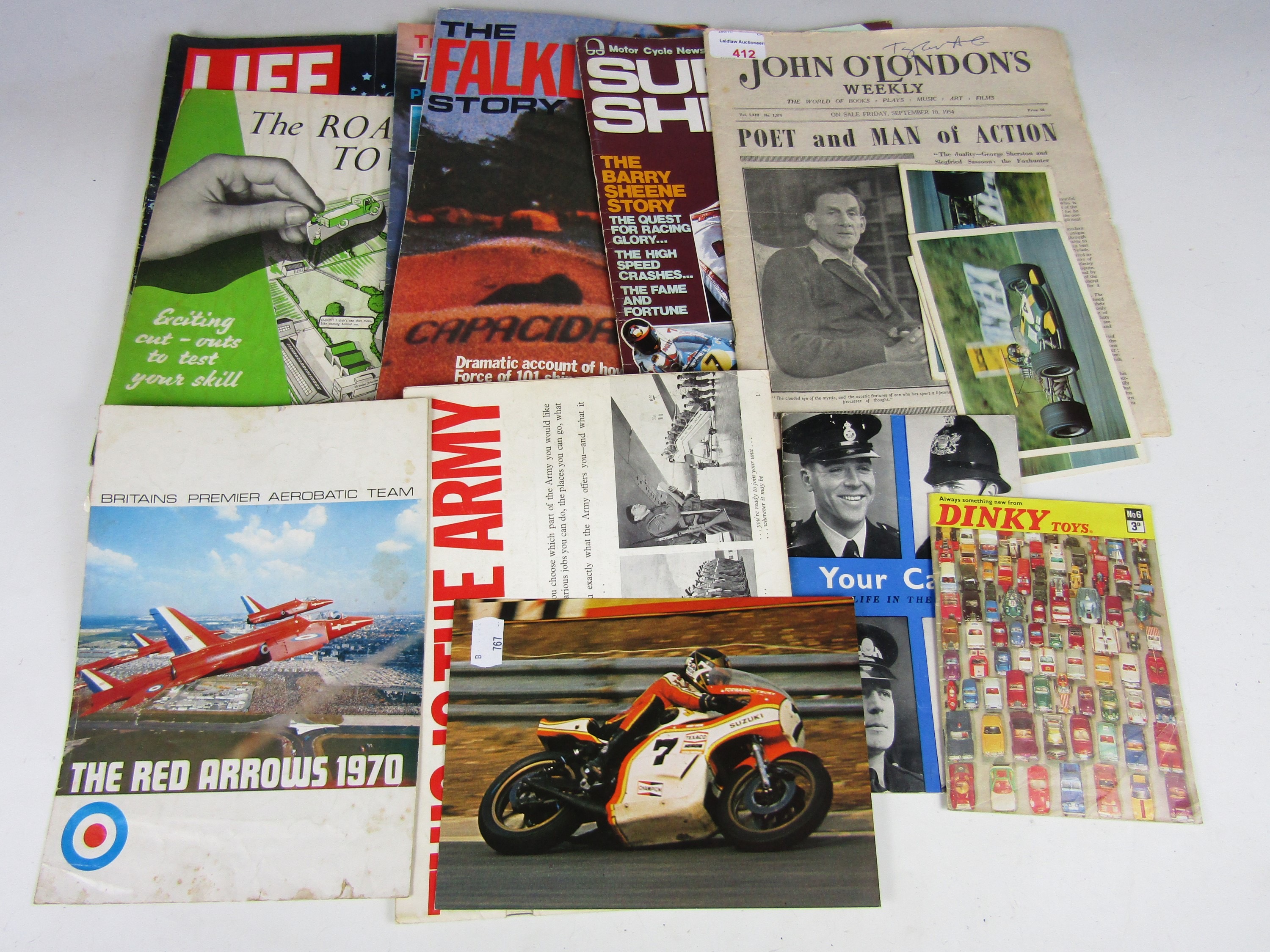 A varied quantity of vintage sporting, automotive and military ephemera