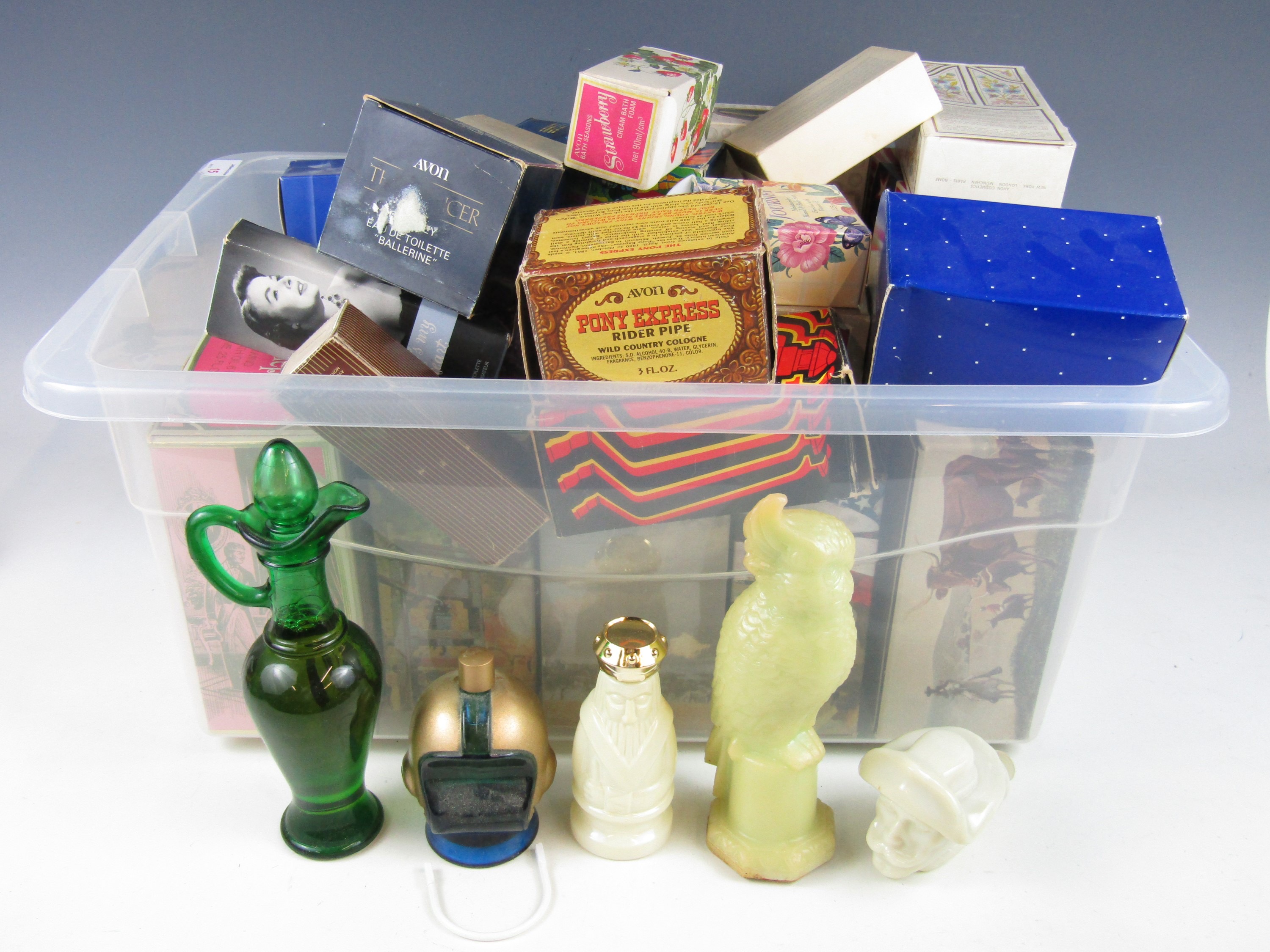 A large quantity of vintage Avon boxed bottles including wild west, sporting, animals and