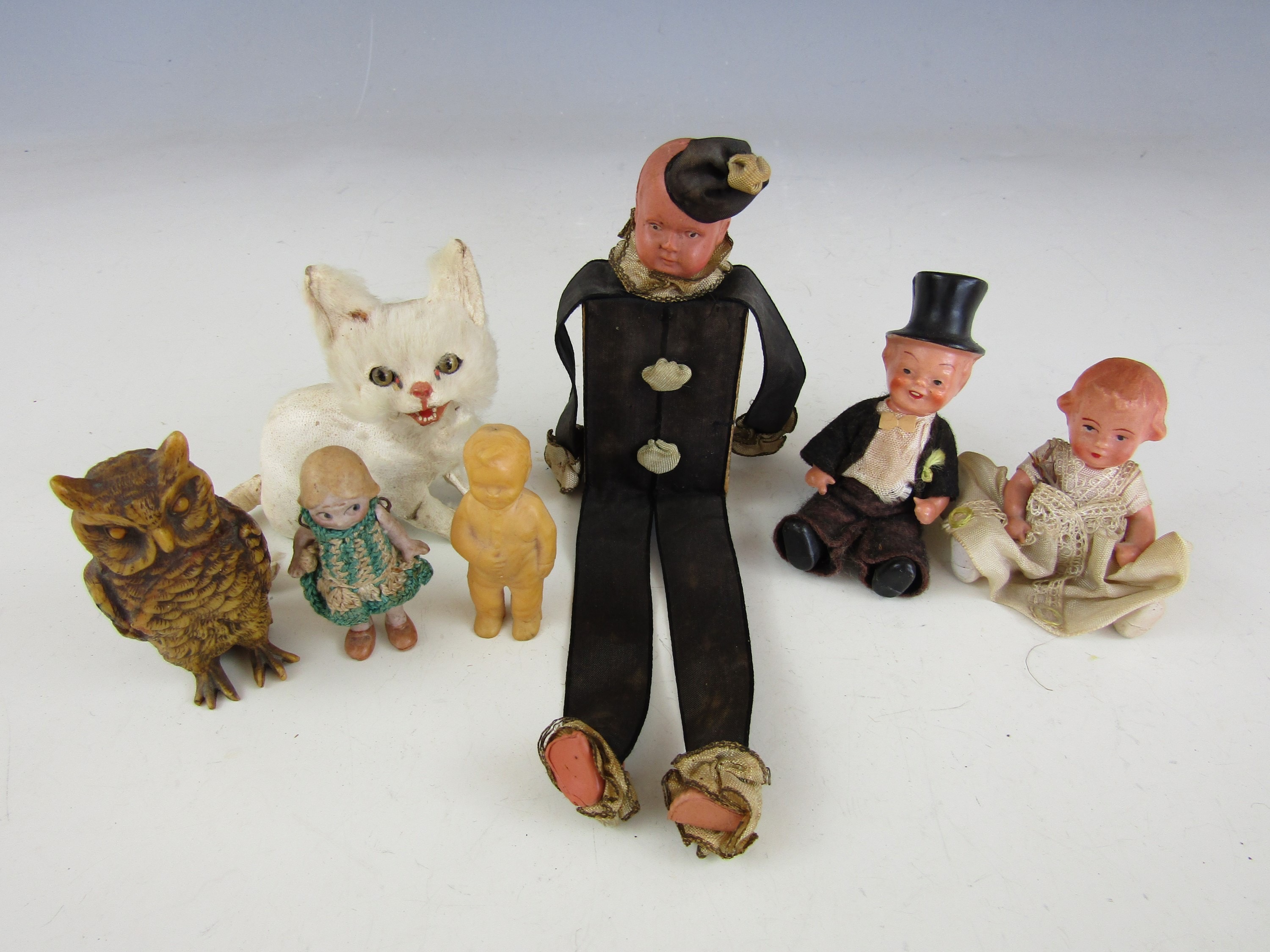 A one of a kind hand made vintage matchbox doll together with other sundry celluloid dolls etc