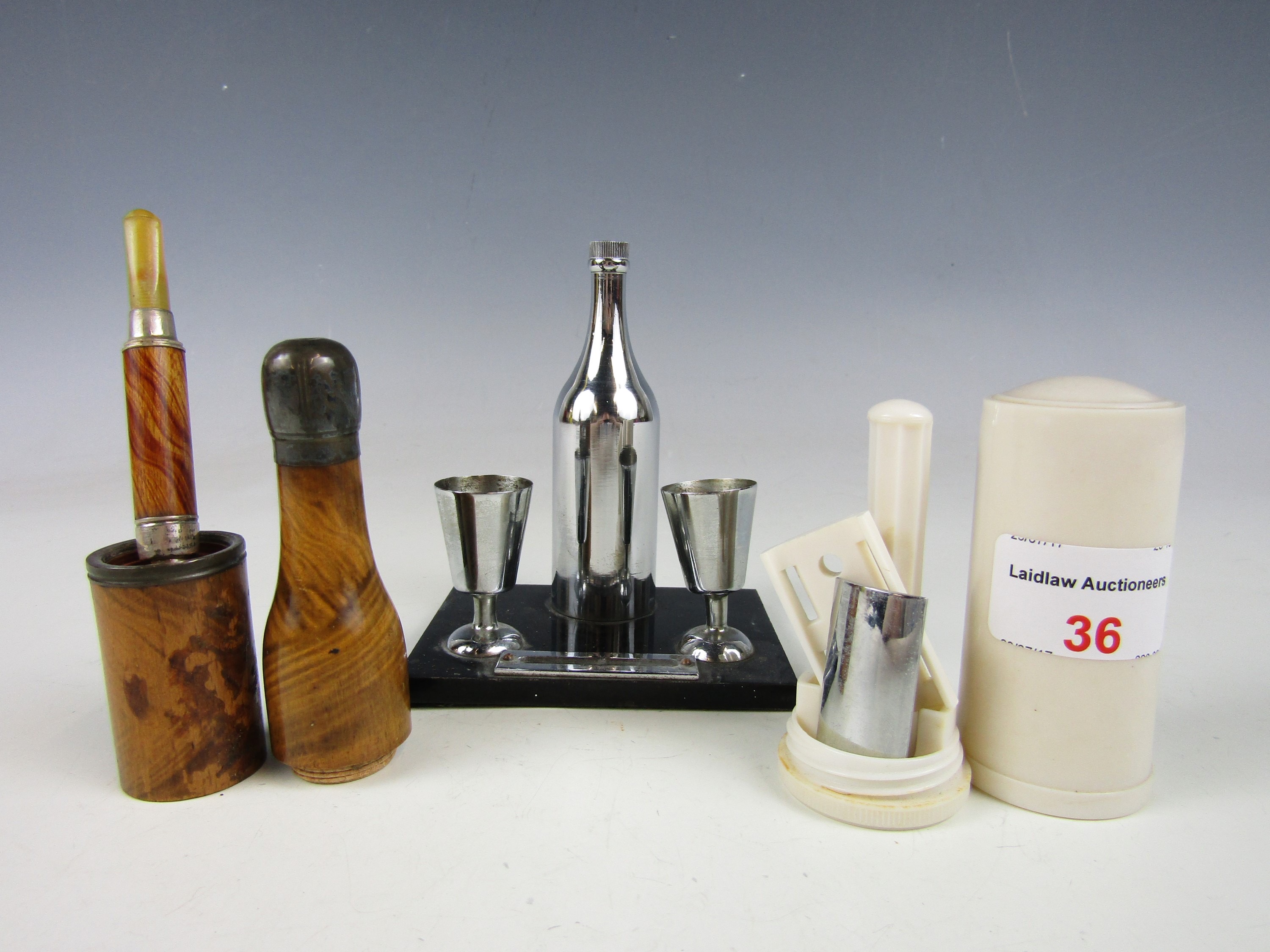 Sundry kitsch collectibles including an Art Deco novelty table cigar lighter modelled as a bottle