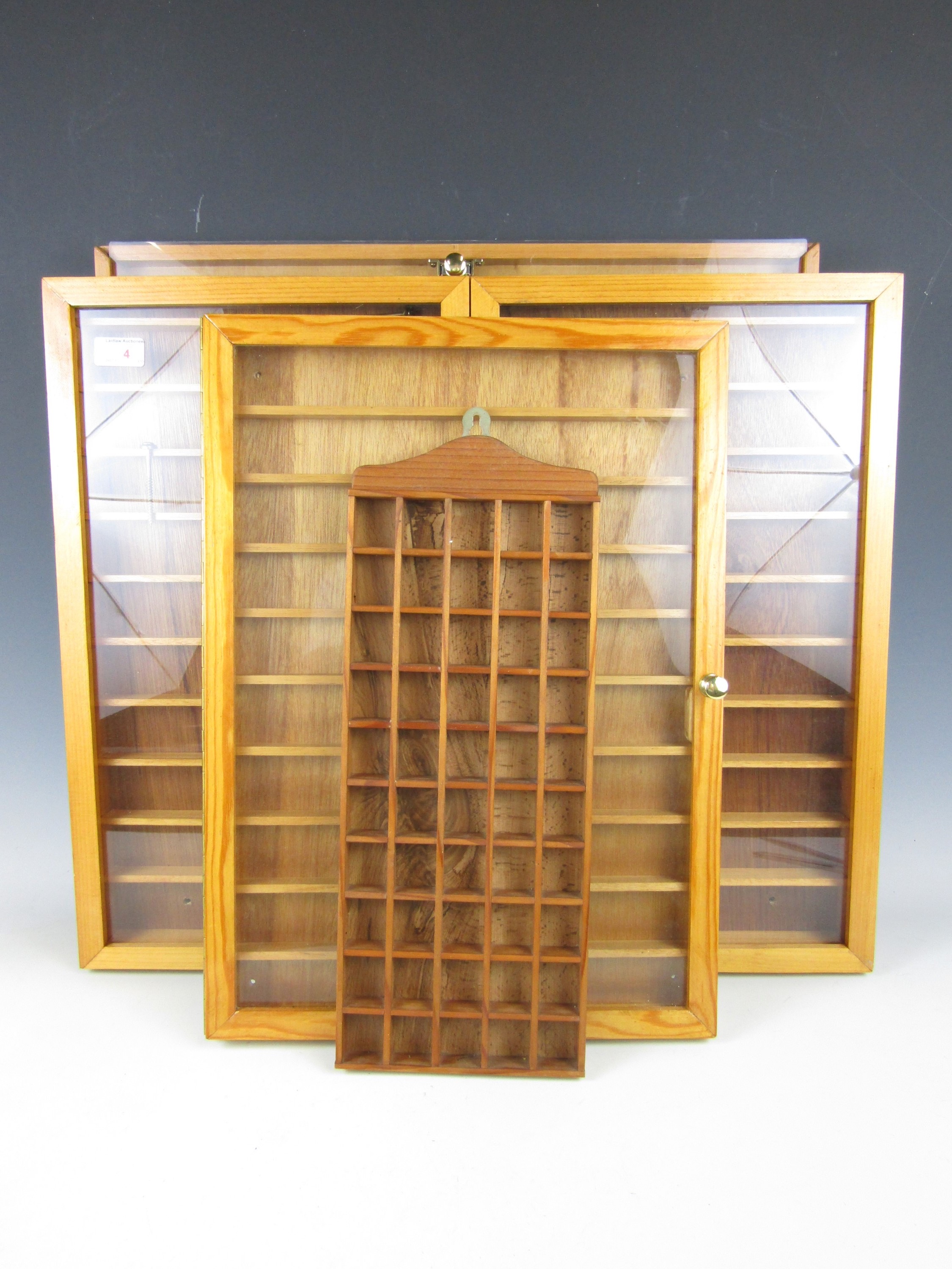 Four thimble display cases