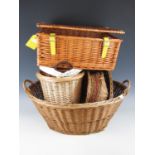 A large wicker basket together with a picnic hamper etc