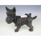 A cast figure of a Scottie dog