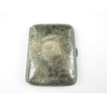 A silver cigarette case with engraved foliate scroll decoration