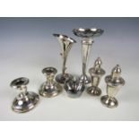 A pair of silver candlesticks, (loaded, a/f), together with other items of electroplate