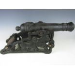 A cast iron garden cannon