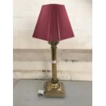 A brass columnar table lamp