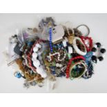 A large accumulation of vintage and modern costume jewellery, including necklaces, bracelets and