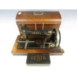 An early 20th Century Vesta hand operated sewing machine