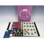 A collectors' album of coins together with sundry coin sets