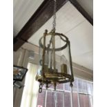 A pendant brass hall lantern