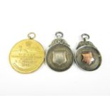 Two silver prize fob medallions and a 1946 shooting prize medal