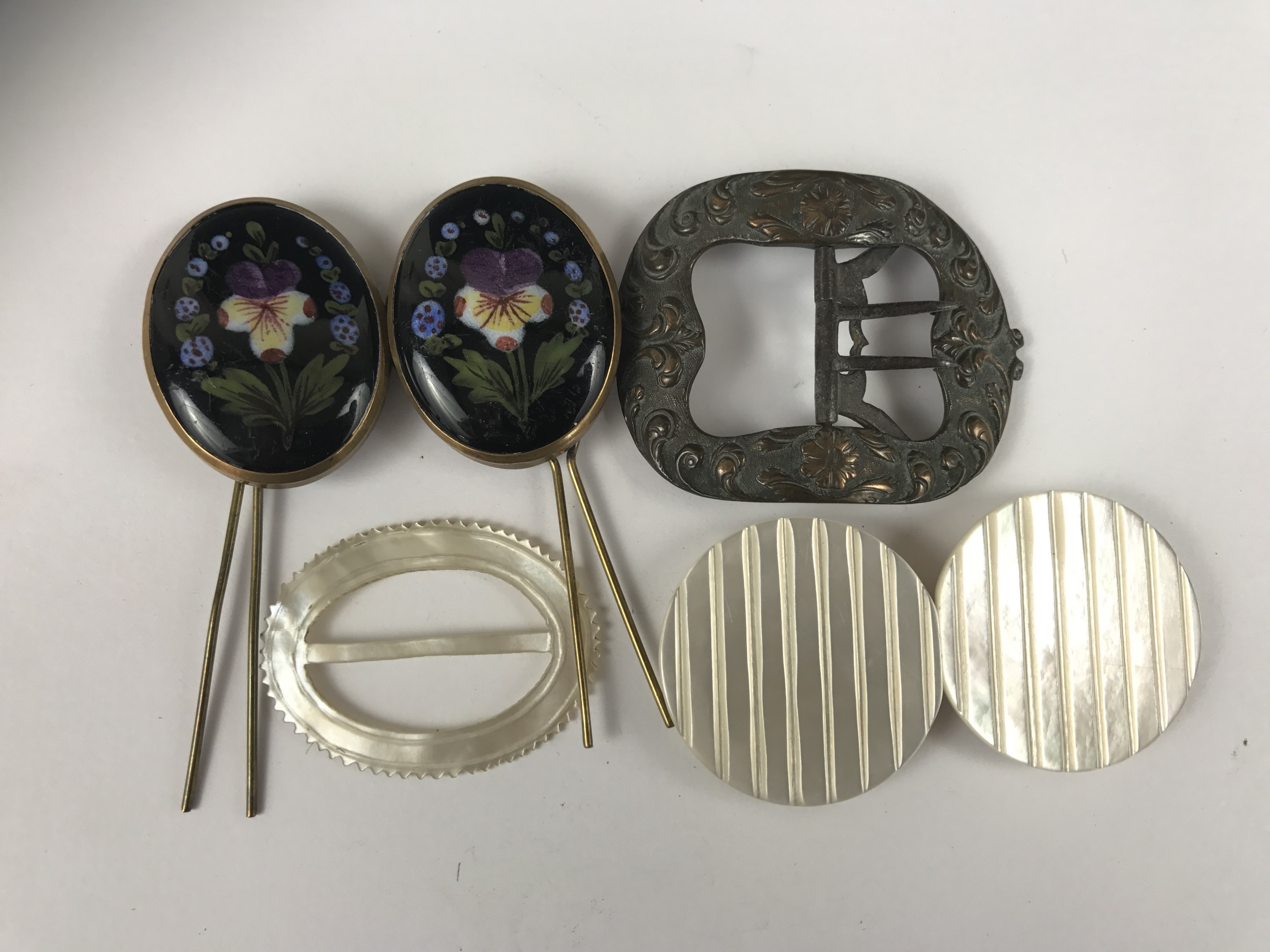 Vintage buckles, including an early 20th Century hand enamelled buckle decorated with pansies