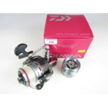 A Daiwa Megaforce 4000x spinning reel together with a spare spool