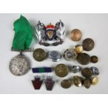 A 1939-1945 British War Medal together with sundry buttons and badges