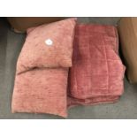 A rose pink chenille bedspread together with a pair of matching down filled scatter cushions