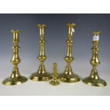 Two pairs of Victorian brass candlesticks together with a weight