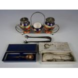 A three piece cruet set in an electroplate stand together with Carlisle related electroplate