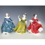 Three Royal Doulton figurines: Stephanie, HN 2811, Simone, HN 2378, and Fragrance, HN 2334