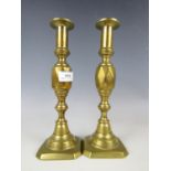 A pair of Victorian brass candlesticks, with faceted knopped stems, 27 cm
