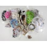A large accumulation of vintage and modern costume jewellery brooches and necklaces