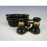 A cased pair of vintage opera glasses