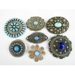 Continental vintage costume brooches, in white and base metal, each set with blue cabochons