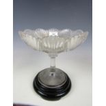 A Victorian pressed glass compote with black glass stand