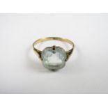 A vintage yellow metal and blue stone dress ring, stamped 9ct, tests as gold