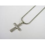 A diamond set cruciform pendant on a white metal neck chain, the latter stamped 375