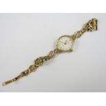 A lady's 9ct gold cased Accurist wrist watch, with quartz movement, on a 9ct gold bracelet strap