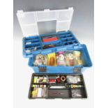 A fly tying box with a large quantity of fly tying materials including capes, mixed goat hair,