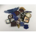 A quantity of vintage enamelled badges, pins and prize fobs