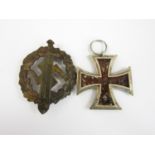 An Imperial German Iron Cross second class and a German Third Reich SA Sports Badge (a/f)