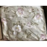 A pair of contemporary linen blend lined floral curtains with a pale celadon ground and tumbling