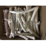 A large quantity of white satin padded clothes hangers