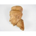 A carved wooden head, the reverse carved H S Krakow, 16 cm