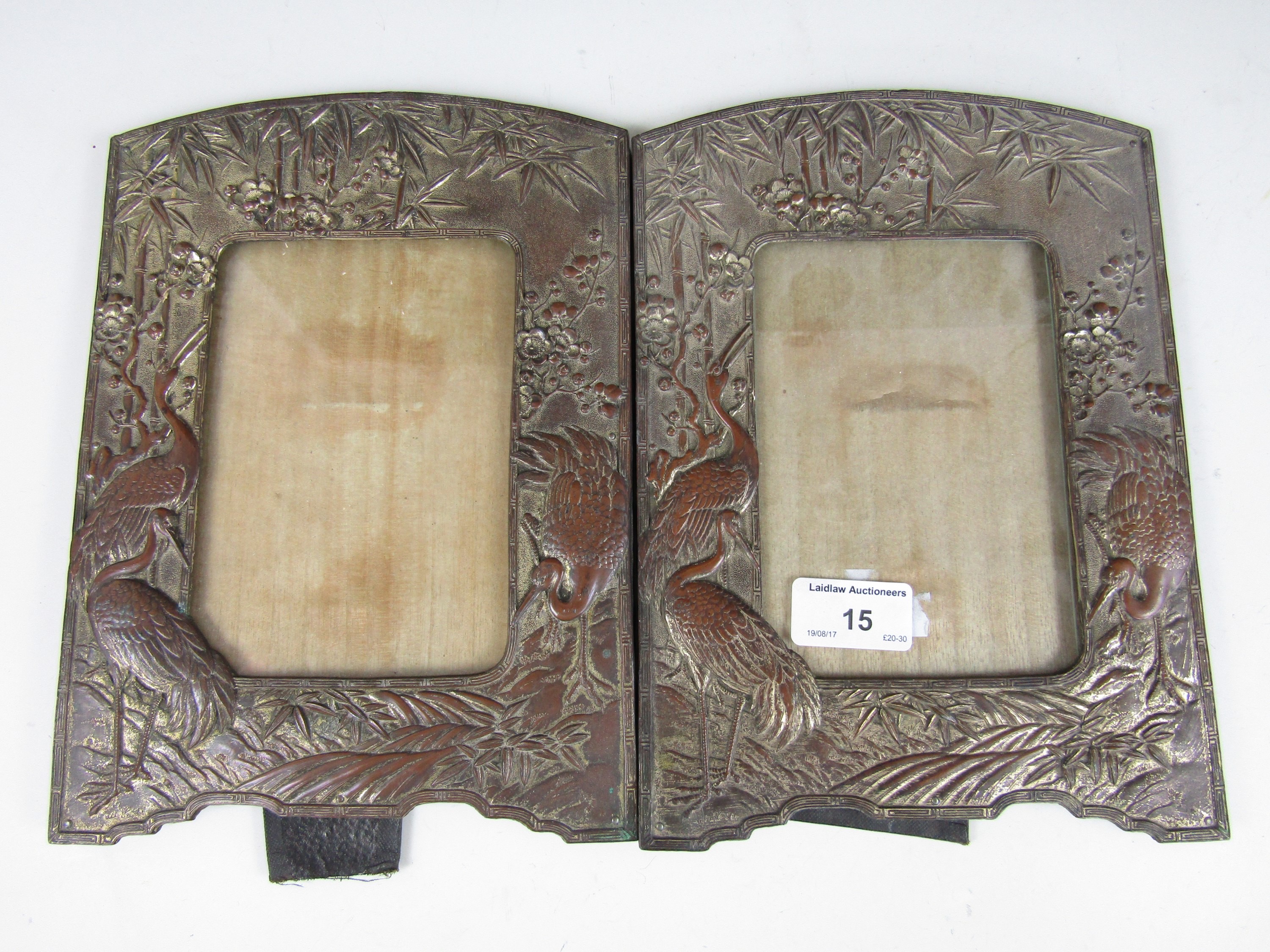 A pair of early 20th Century Japonisme electroplate photograph frames
