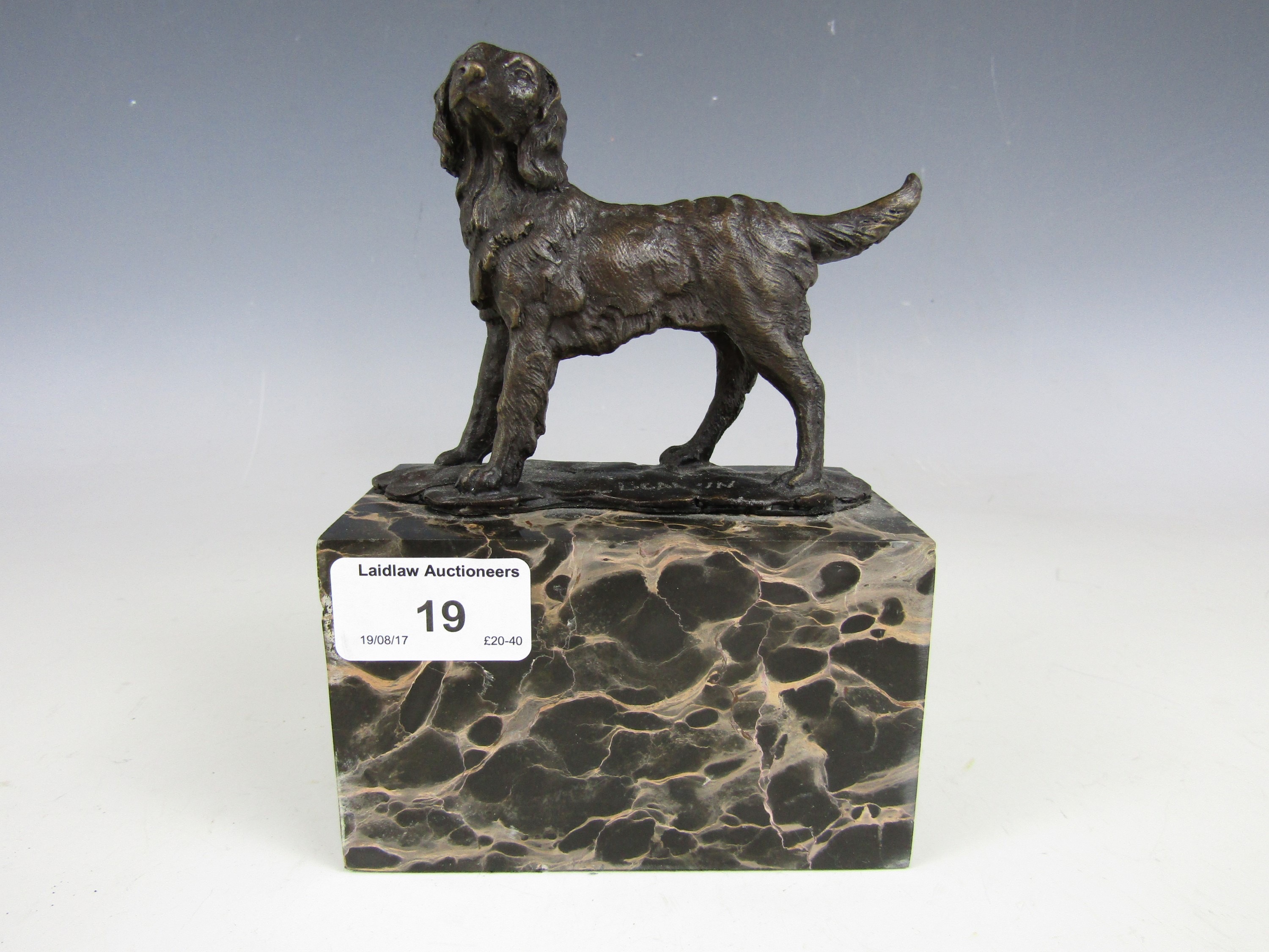 A contemporary cold cast bronzed dog on marbled plinth, signed 'L. Garin'