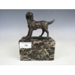 A contemporary cold cast bronzed dog on marbled plinth, signed 'L. Garin'