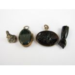 A 19th Century fob seal with bloodstone matrix, together with one other fob carved in depiction of