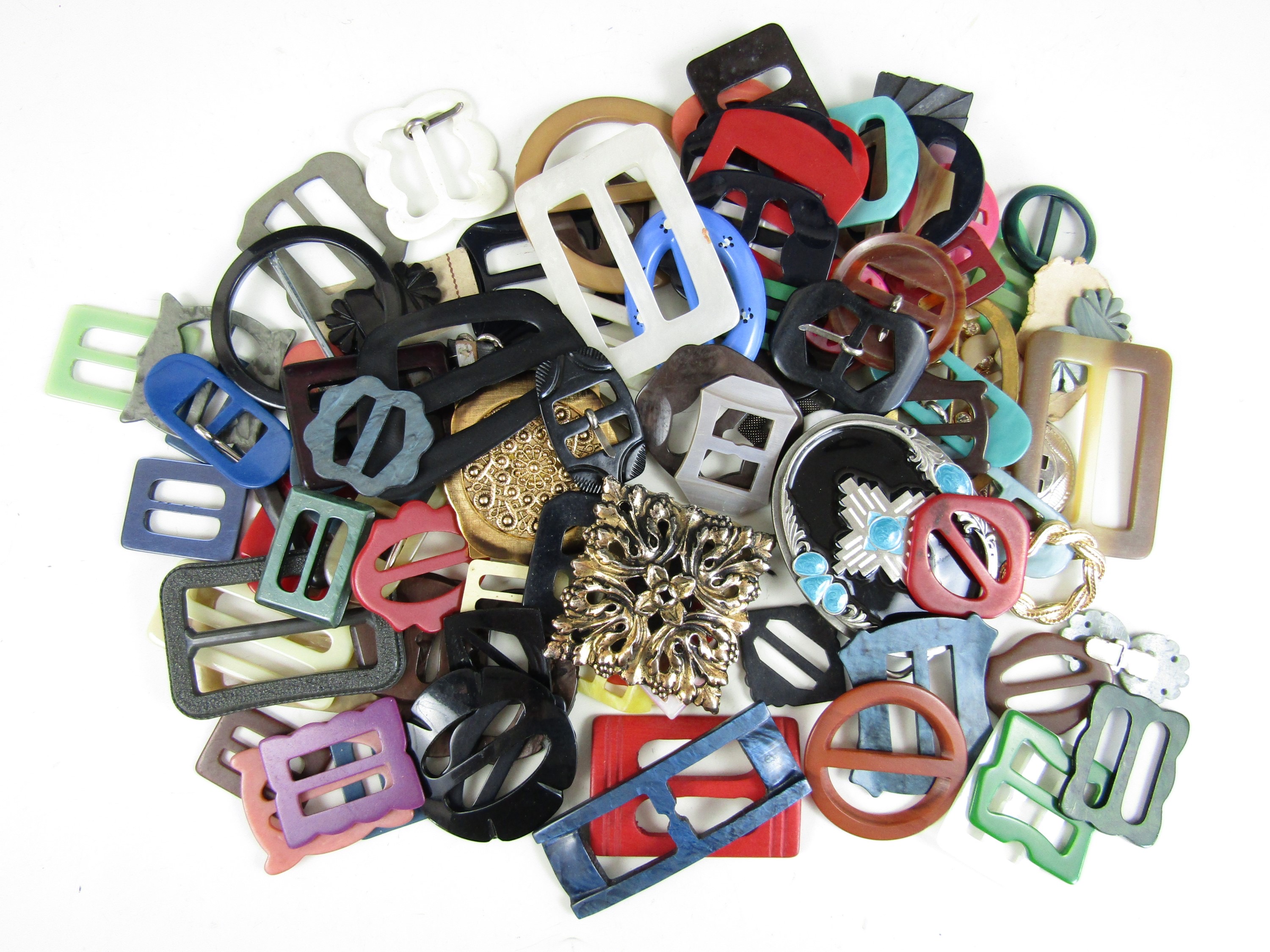 A large accumulation of vintage lucite and other dress buckles