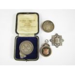 A silver fob medal 'GS FA Elliott Shield 1923' together with a silver 'Small Rifle Bore Association'