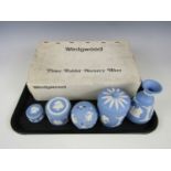Five Wedgwood blue Jasperware items together with a boxed Wedgwood four piece Peter Rabbit nursery