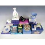 A quantity of boxed ceramics including Wedgwood bud vases, trinket pots and a Lilliput Lane ornament