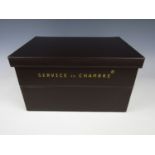 A selection of four Service de Chambre room service boxes