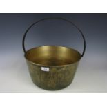 A large Victorian brass jam pan