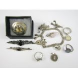 Vintage silver and white metal jewellery, including a charm bracelet, two marcasite rings, and a