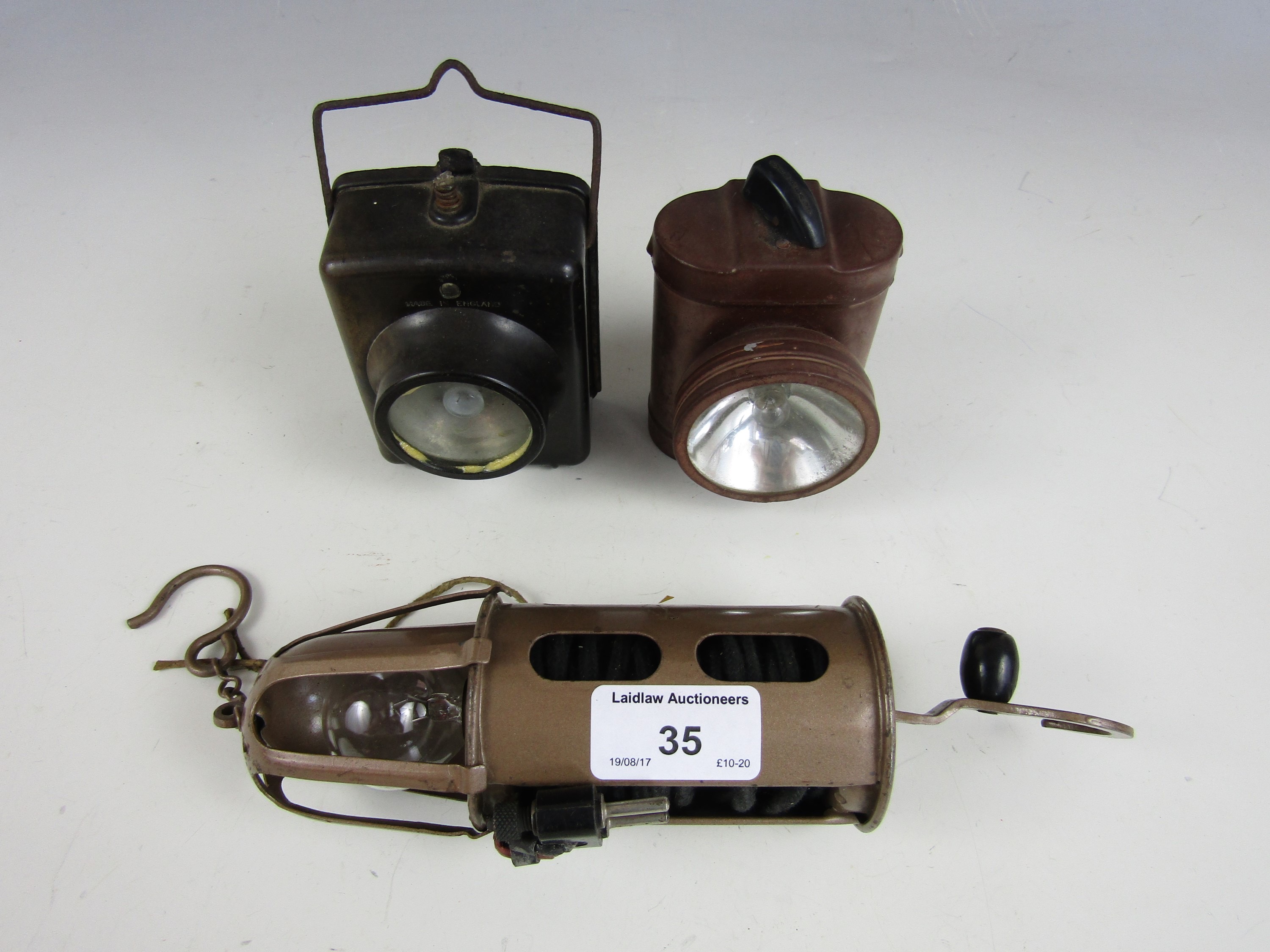 An RAF / Air Ministry inspection lamp and two vintage torches