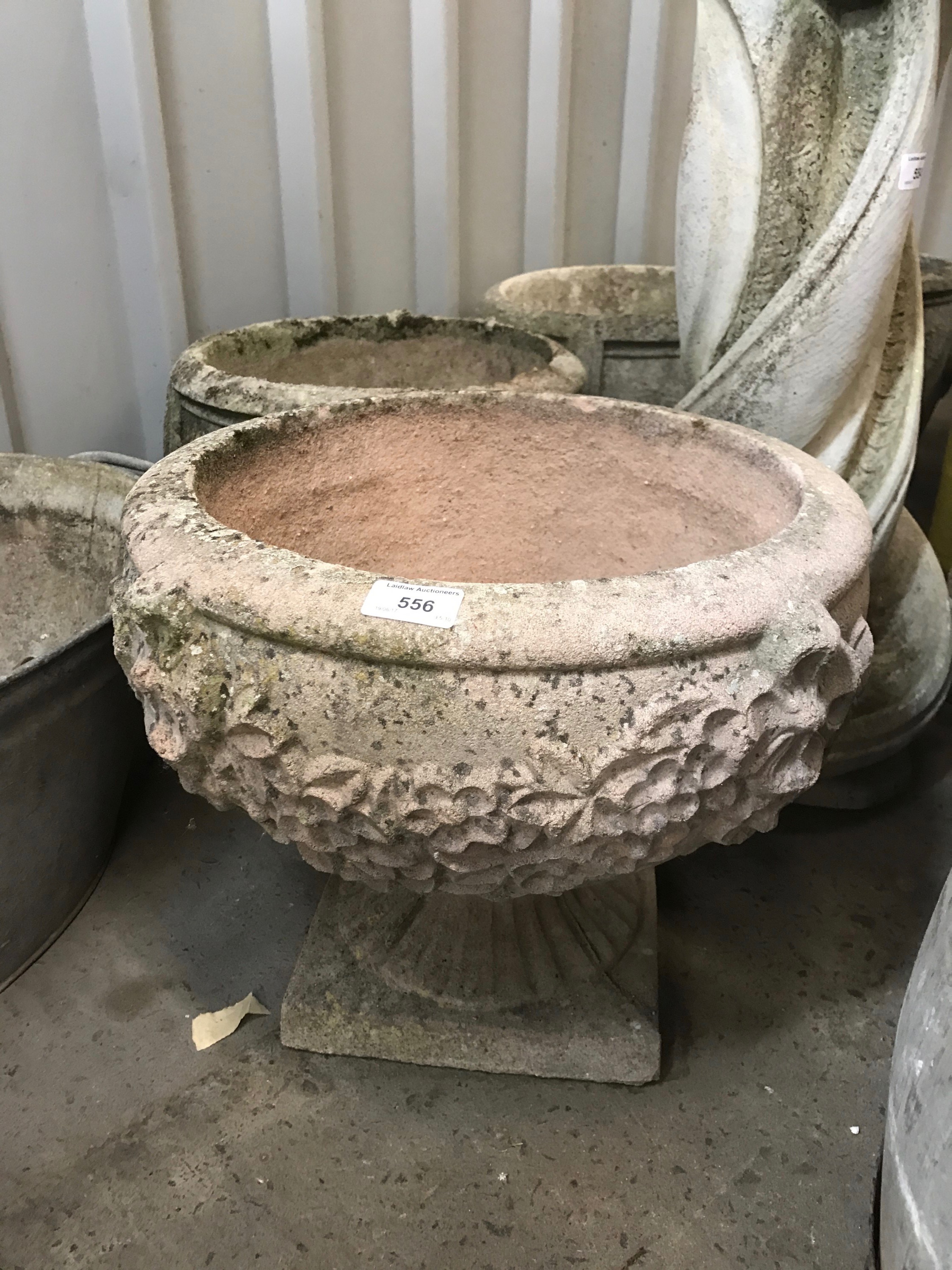 A pre cast garden urn